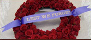 Link to funeral page. The image is a flower wreath.